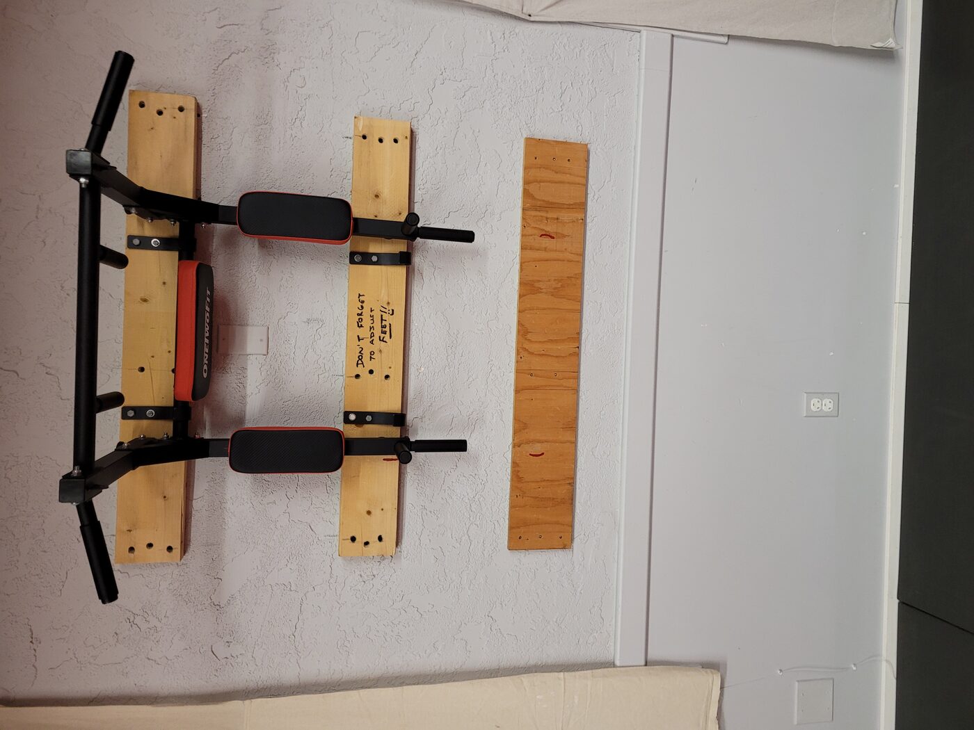 Wall-mounted pull-up bar
